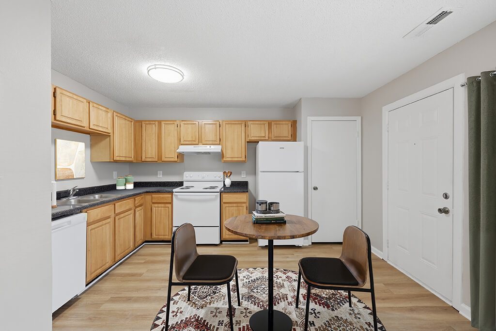 Kitchen with seating area at Greens of Pine Glen in Durham NC